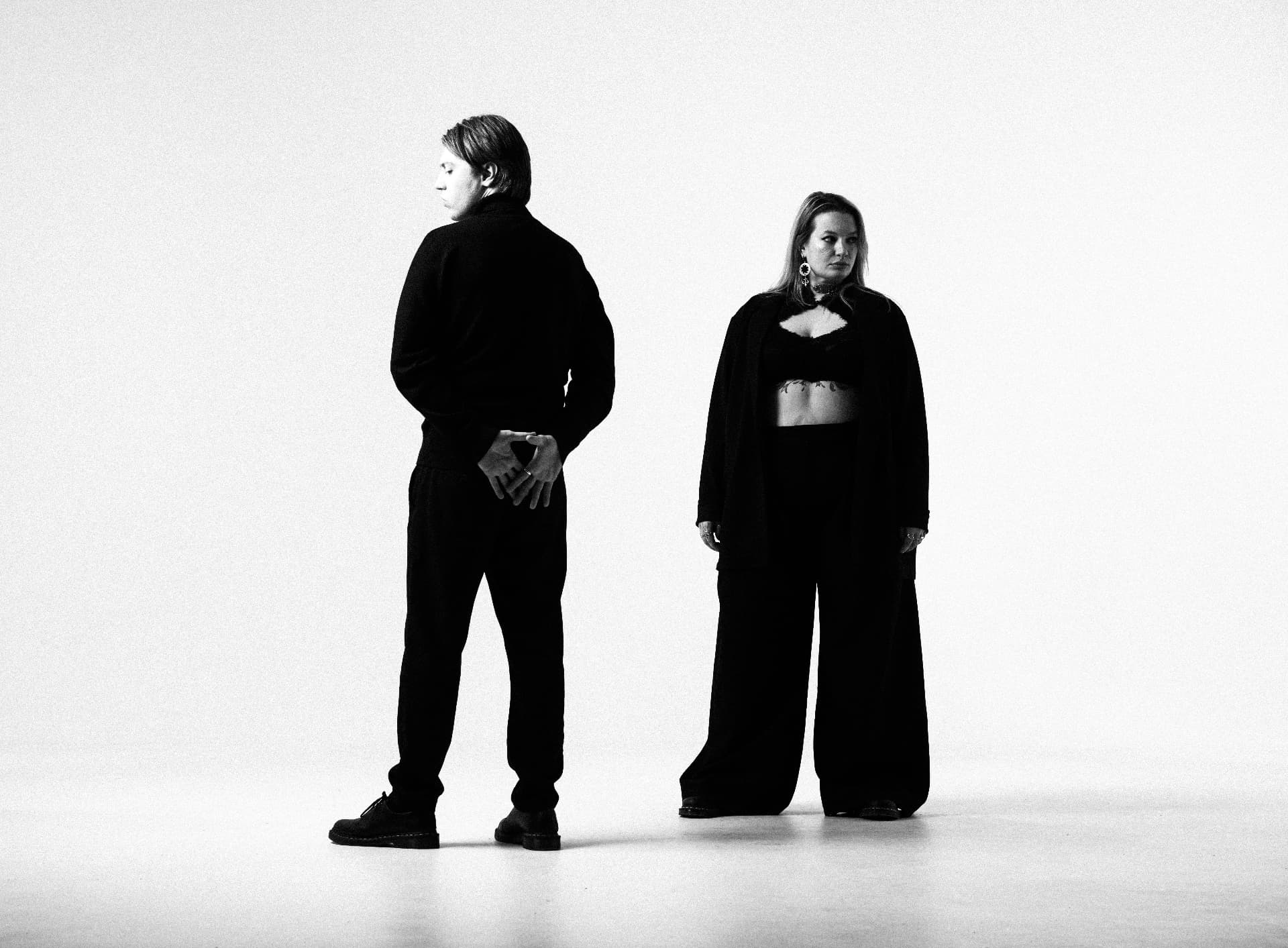 Black and white studio portrait of two members of Clockwork Animals